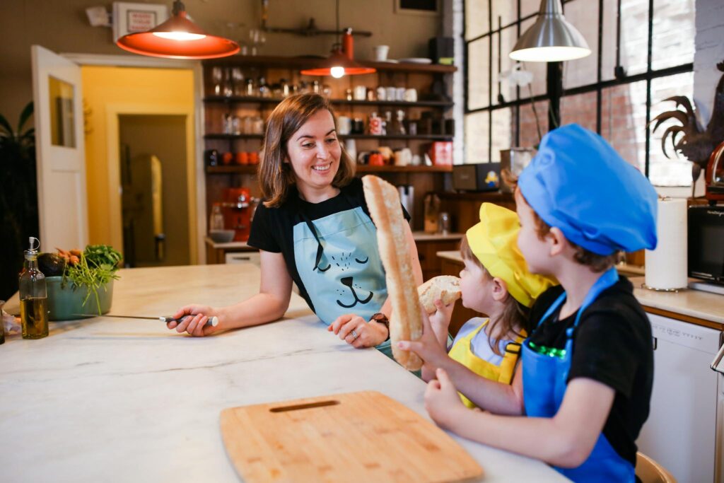 Girl in Black Tank Top and Blue Cap Sitting on Chair