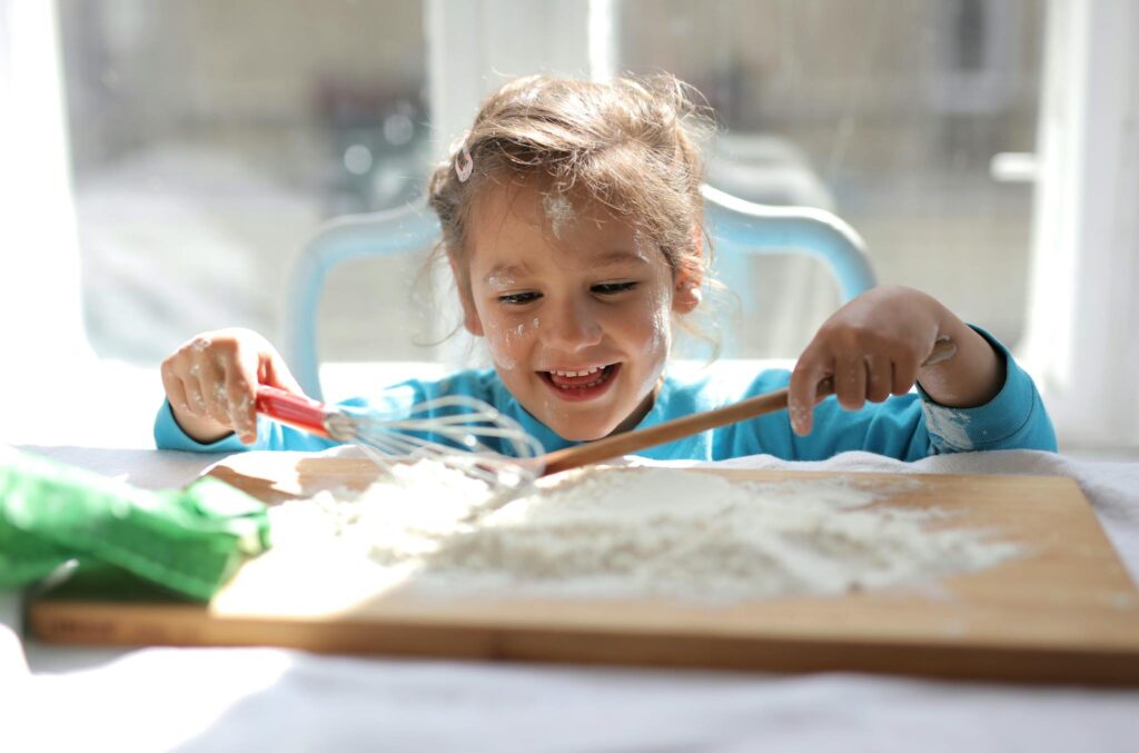 Girl Playing with Kitchen Equipment